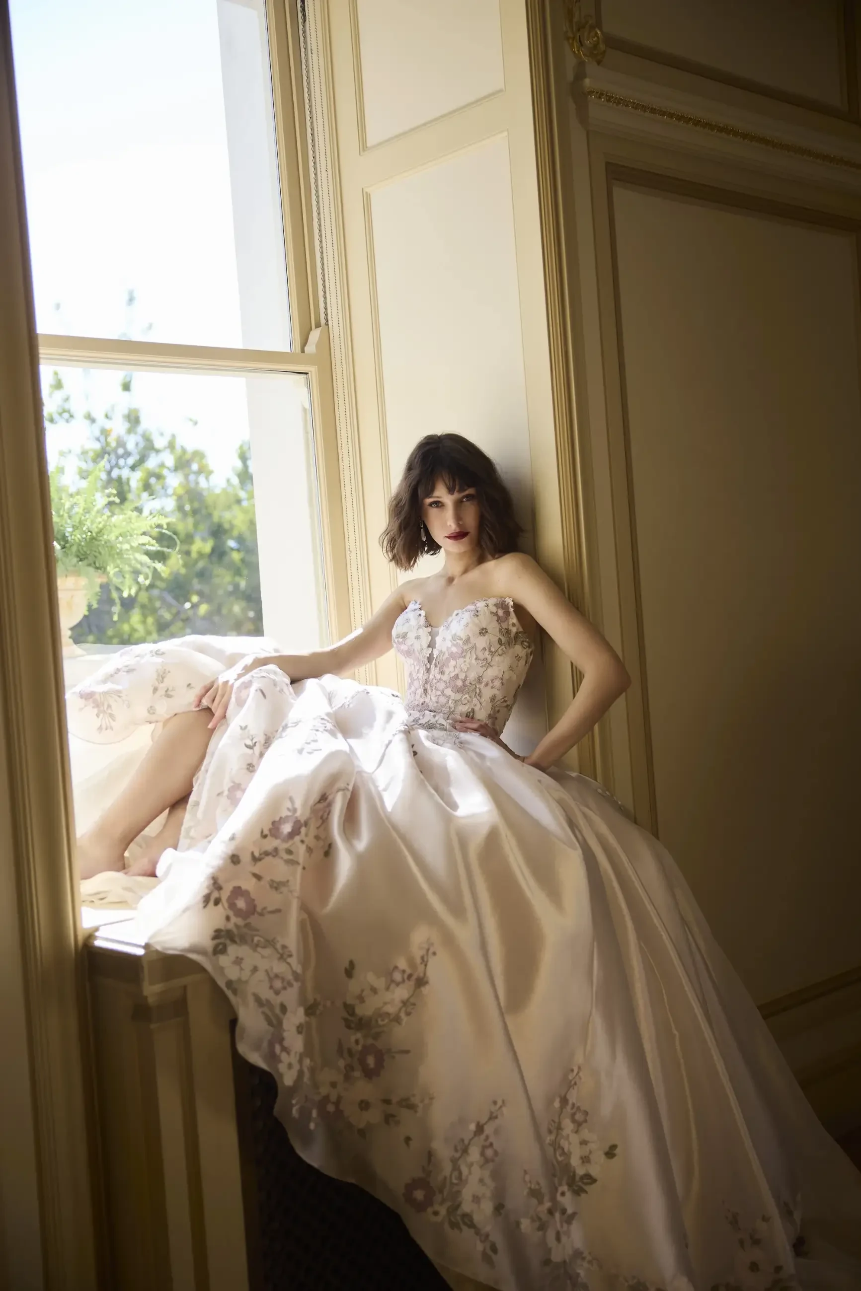 model is wearing a strapless a-line bridal gown