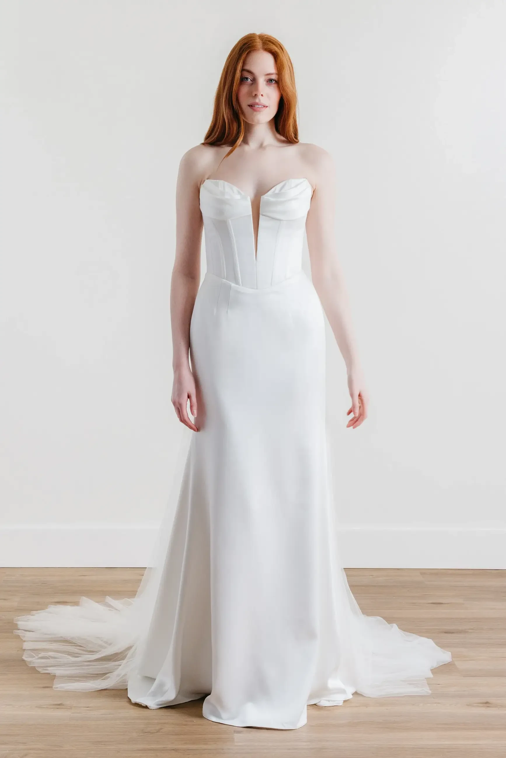 model is wearing a strapless wedding gown