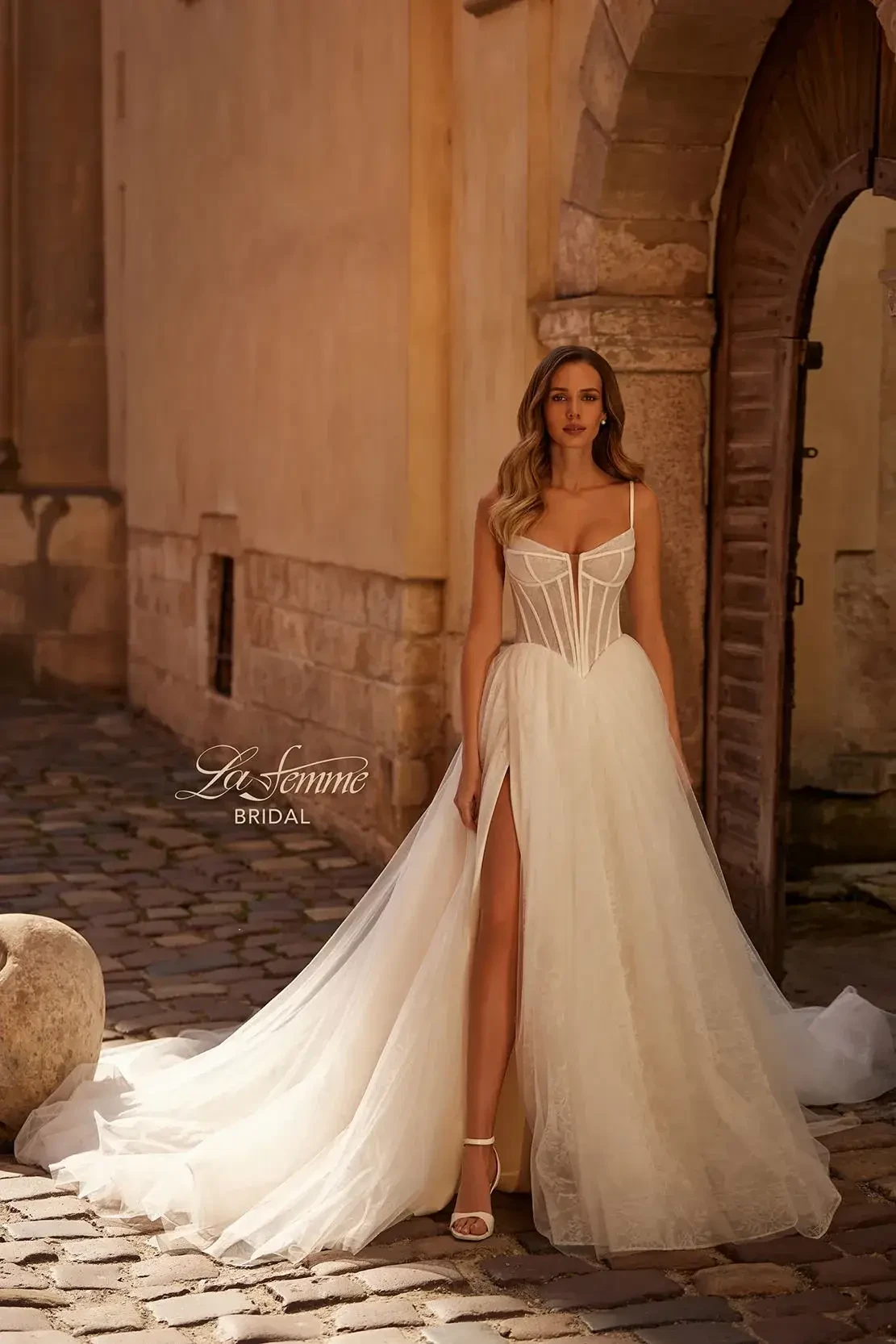 model is wearing a sleeveless a-line bridal gown