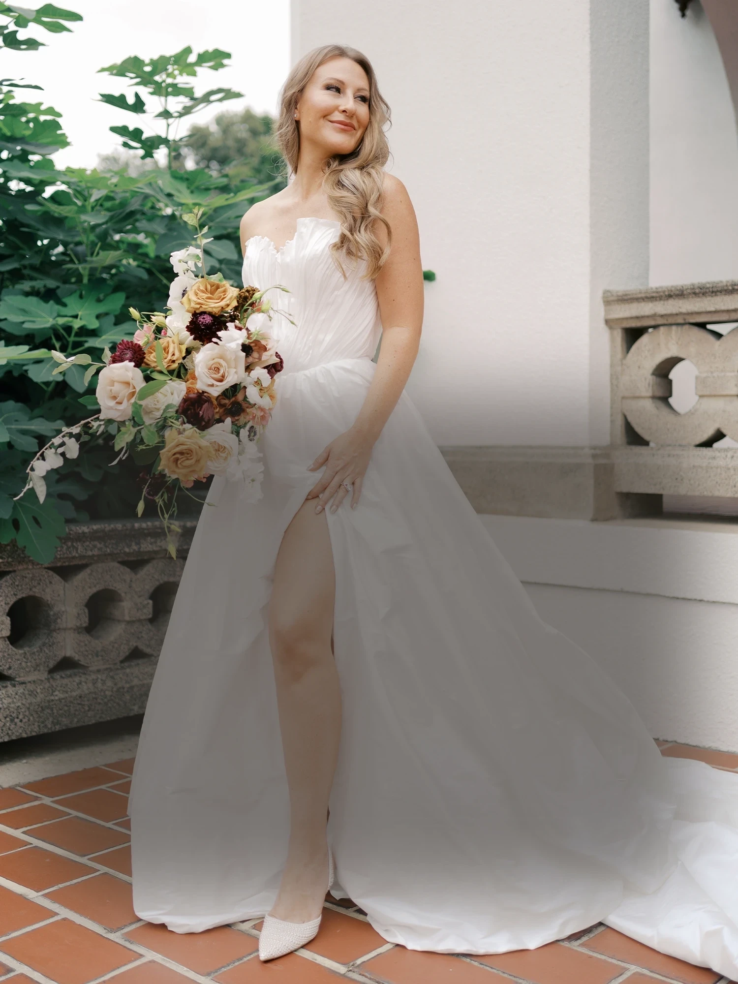 Model wearing a bridal gown. Mobile image