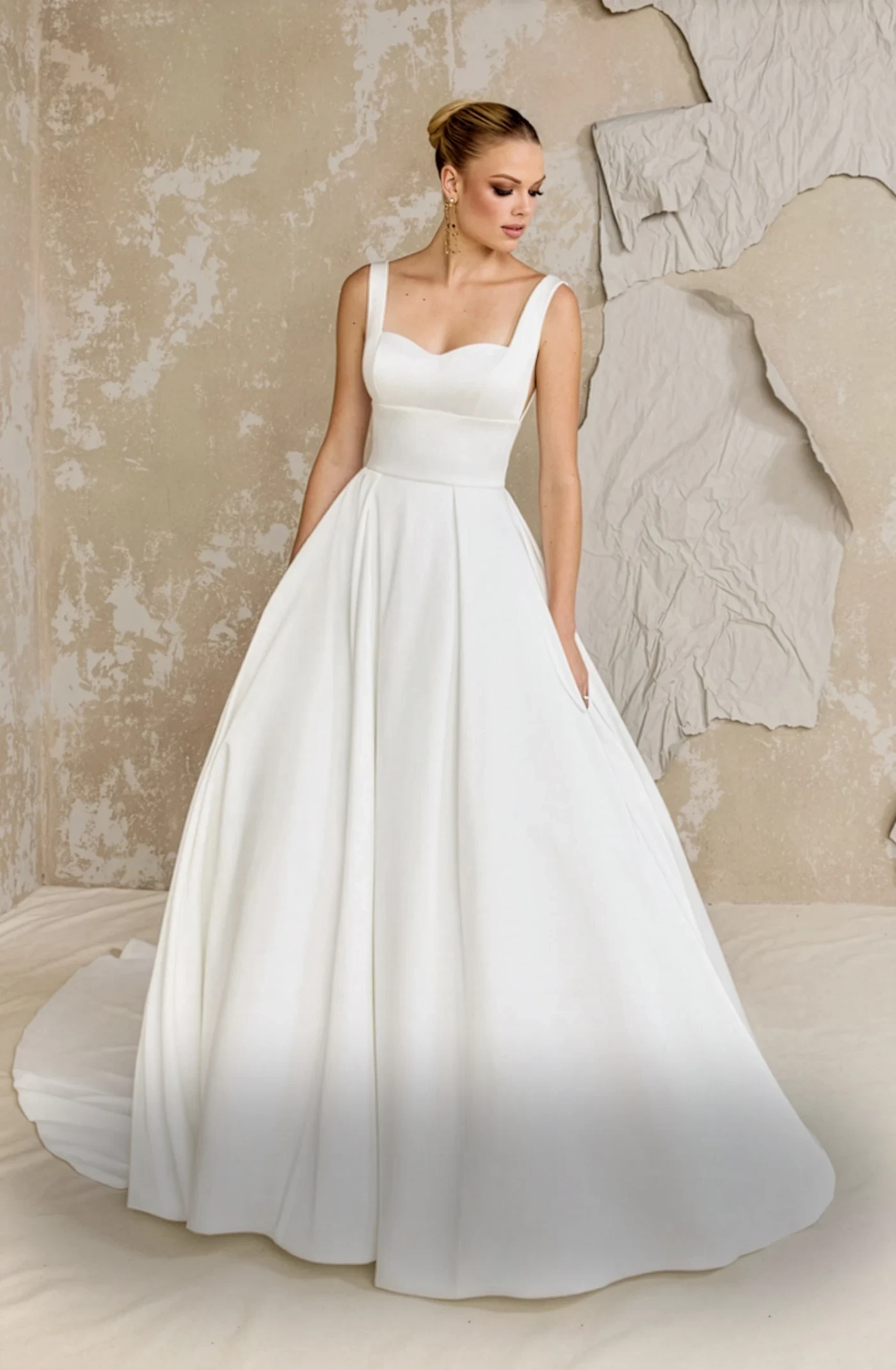 Model wearing a gown by Justin Alexander