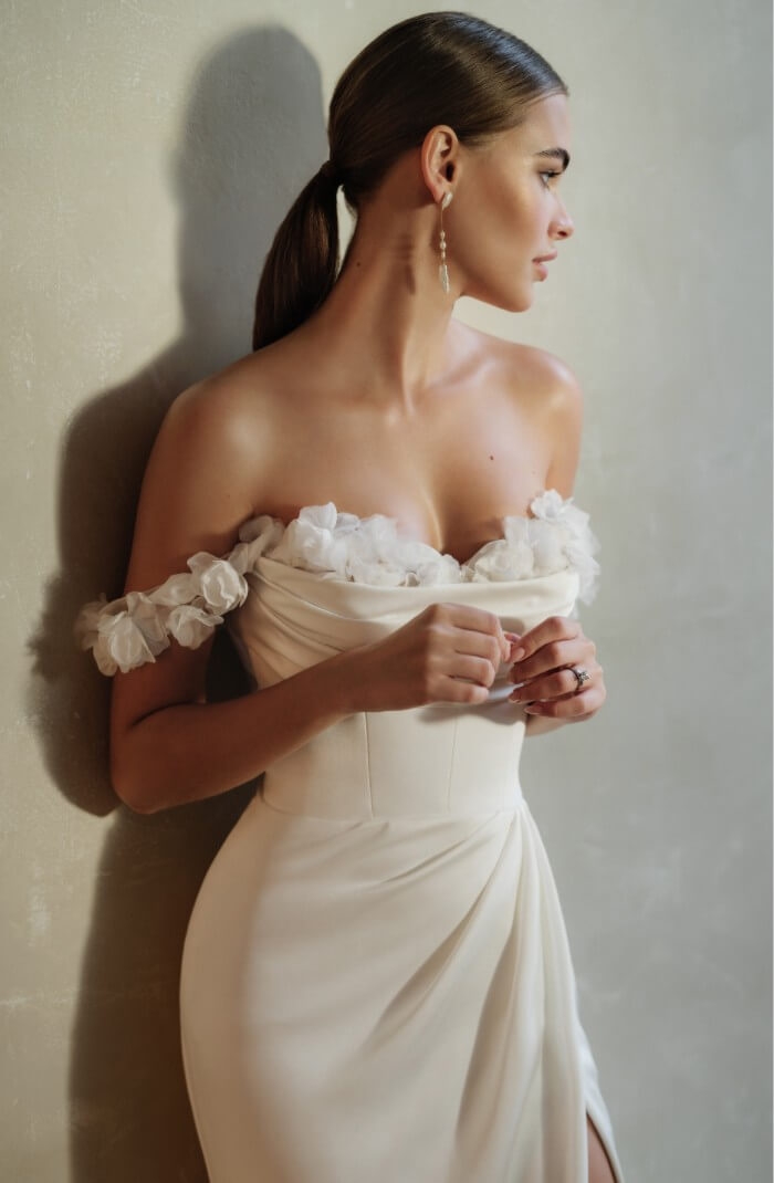 Model wearing a gown by Justin Alexander