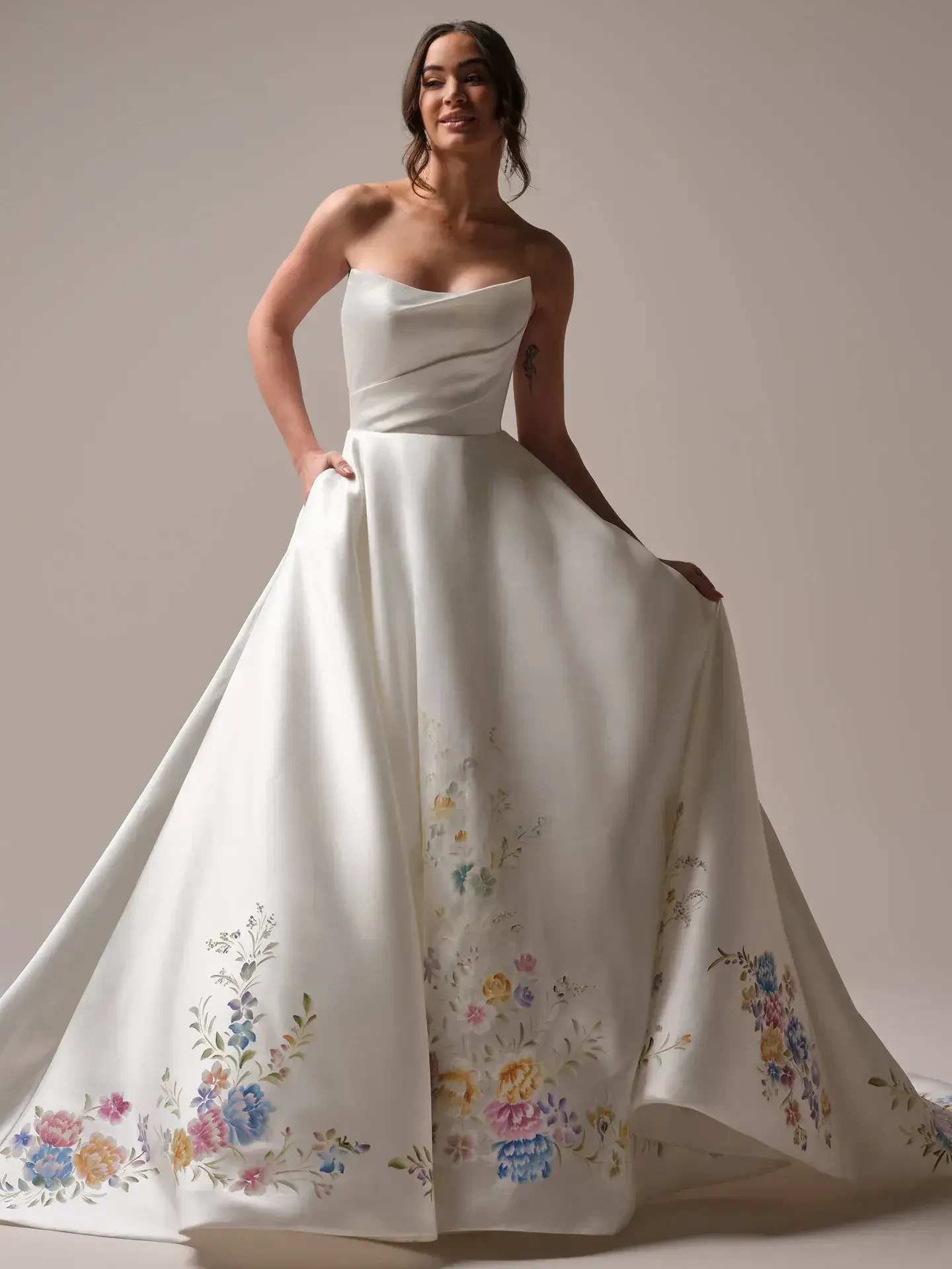 model is wearing a strapless ball gown wedding dress