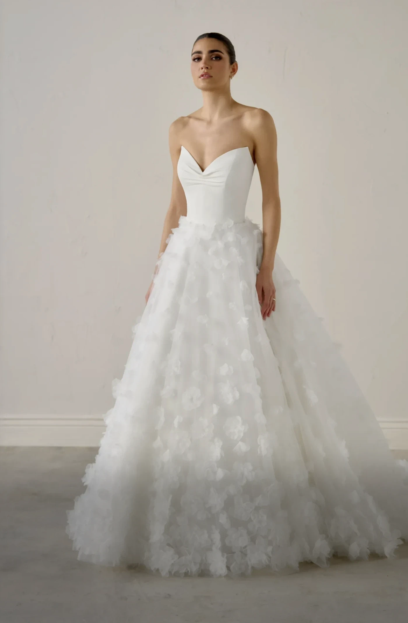 Model wearing a gown by Justin Alexander